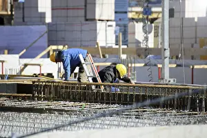House Construction Drucke: Construction work on the foundations of a large apartment building