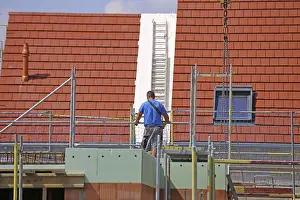 New Construction Site Drucke: Construction worker (bricklayer) on the building site (Mutterstadt development area)
