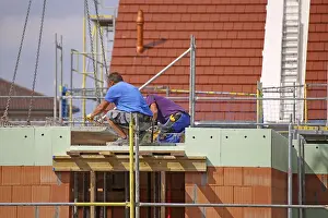 German Construction Industry Drucke: Construction worker (bricklayer) on the building site (Mutterstadt development area)