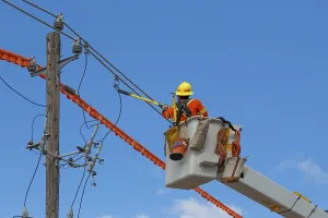 Construction Site Labourer Drucke: Contractor at work fixing electric lines