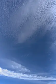 Central Europe Cloudy Days Drucke: Contrails and cloud formations in the blue sky