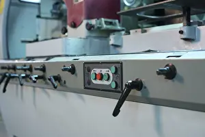 Industrial Machine Drucke: Control panel with buttons and levers on machine