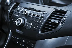 Compact Disc Storage Medium Drucke: Control panel and cd in a modern car