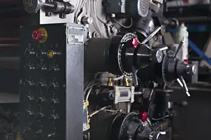 Factory Production Line Drucke: Control panel of typography machine and red buttons
