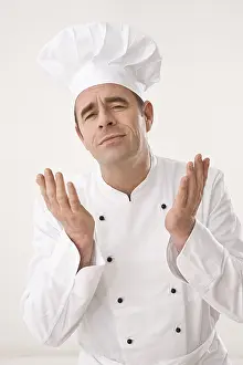 Studio Shot Of A Chef Drucke: Cook gesticulating