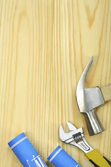 Studio Photography Drucke: Copyspace image of hammer spanner and blueprints