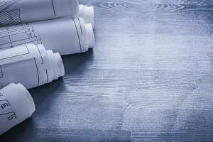 Rolled Up Blueprints Drucke: Copyspace image five rolls of blueprints very close up