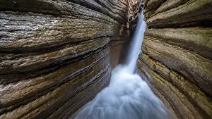 Eroded Mountain Creek Drucke: Course of the Taugl river with waterfall