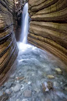 Uninhabited River Landscape Drucke: Course of the Taugl river with waterfall