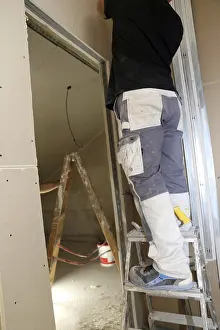 Residential Building Renovation Drucke: Craftsmen doing drywall work