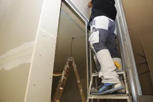 Residential Building Renovation Drucke: Craftsmen doing drywall work