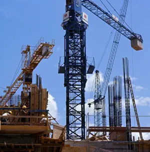Home Construction Process Drucke: Cranes on the building site, structural engineering