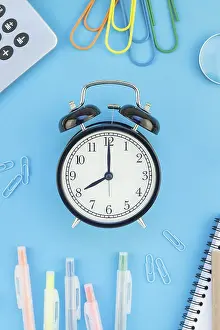 Colorful Office Supplies Drucke: Creative flat lay top view back to school concept with alarm clock