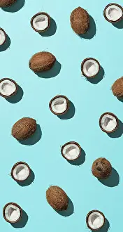 Urban Environment Image Drucke: Creative layout of coconuts half on blue background