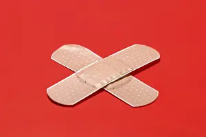 Emergency Medical Care Drucke: A cross-shaped adhesive plaster