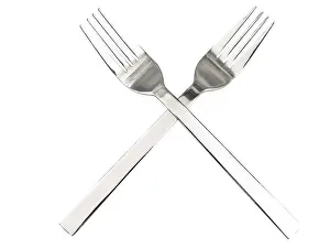 Empty White Table Setting Drucke: Crossing silver forks against the white background