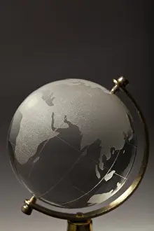 Deserted World Map Drucke: Crystal glass globe on gradient gray background