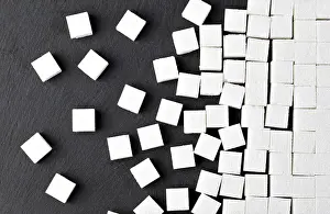 Black Background Drucke: Cubes of sugar on black background