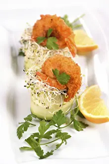 Healthy Seafood Meal Options Drucke: Cucumber appetizer with fried breaded shrimp on a bed of microgreens