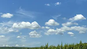 Nice Weather Conditions Drucke: Cumulus clouds cluster clouds in front under blue sky