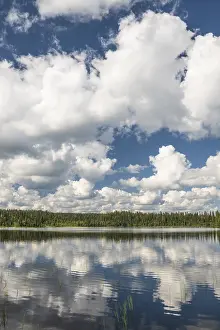 European Countryside Landscape Shots Drucke: Cumulus clouds are reflected in a forest lake