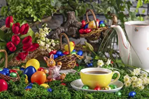 Christian Holiday Traditions Drucke: A cup of coffee next to a coffee pot surrounded by springtime Easter decorations