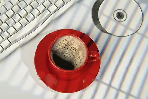 Isolated Coffee Cup Drucke: Cup of coffee, DCs and keyboard on a studio background