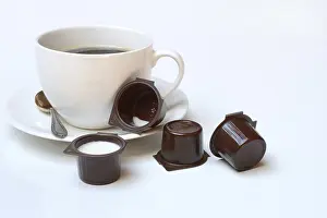 White Background Coffee Drucke: Cup of coffee and milk in portion pack