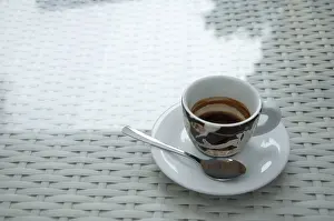 Breakfast Meal Setup Drucke: Cup of coffee on white table. Space for text