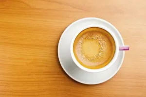 Caffeine Nutrition Facts Drucke: Cup of espresso coffe on table, shot from above
