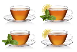 Close Up Cup Of Tea Drucke: Cup of tea with mint and lemon on a white background