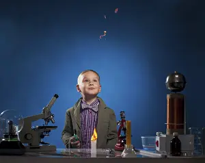 Schoolboy Scientist Drucke: Curious experimenter watching flying fire in lab