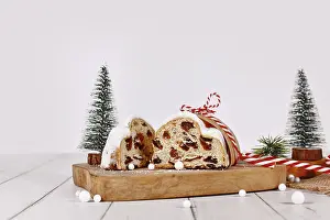 Christmas Fruit Bread Drucke: Cut open German Stollen cake, a fruit bread with nuts