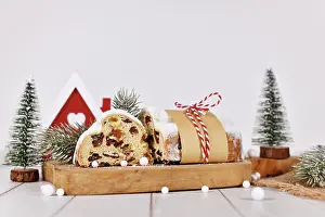 Christmas Fruit Bread Drucke: Cut open German Stollen cake, a fruit bread with nuts