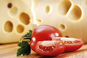 Studio Environment Food Photography Drucke: Whole and cut tomatoes in front of cheese