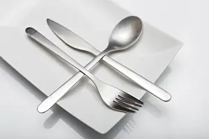 Minimal Cutlery Design Drucke: Cutlery on white table. Minimal designed fork