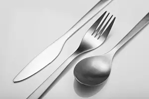 Sterling Silver Cutlery Set Drucke: Cutlery on white table. Minimal designed fork