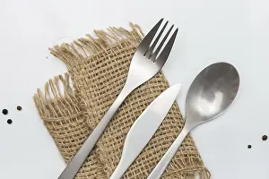 White Studio Environment Drucke: Cutlery on white table. Minimal designed fork