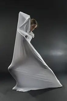 Female Dancer Pose Drucke: A dancer gracefully interacts with white fabric