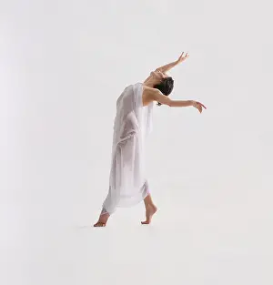 Dancer In Motion Drucke: A dancer moves expressively in a spacious