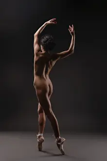 Ballet Dancer Drucke: A dancer performs elegant ballet movements in a soft light