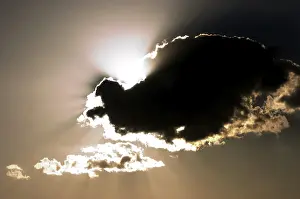 Cloudy Atmosphere Photography Drucke: Dark cloud in back light