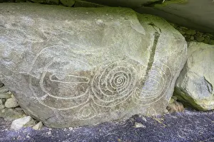 UNESCO World Heritage Site Ireland Drucke: Decorated wall stone at the Knowth megalithic complex
