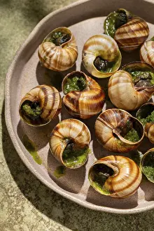 French Cuisine Drucke: From above a delectable dish of baked escargots