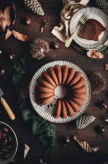 Chestnut Cake Drucke: A delicious chestnut cake sits elegantly on a rustic table
