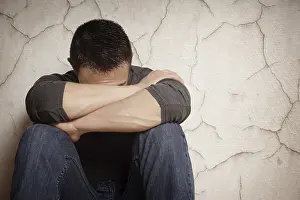 Depressed Young Adult Drucke: depression devastated young man hiding his face