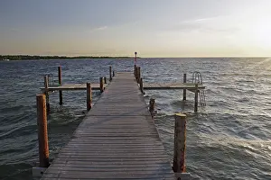 Footbridge Over The Sea Drucke: Deserted bathing jetty in the sunset