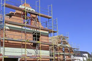 Scaffolding Construction Site Drucke: Detached house under construction