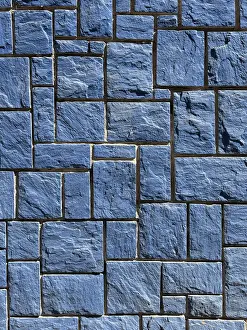 Modern Architectural Design Drucke: A detailed image of a blue stone wall featuring interlocking rectangular tiles with a rough texture