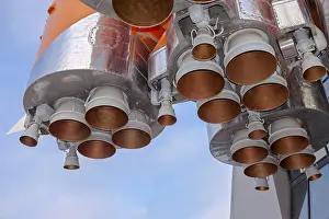 Russian Space Exploration Drucke: Details of space rocket engine over blue sky background